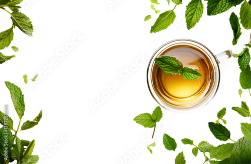 The frame contains mint leaves and a cup of green herbal or plant-based tea with a fresh mint leaf, isolated on a transparent background png