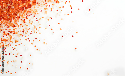 Red and orange confetti falling on a white background.