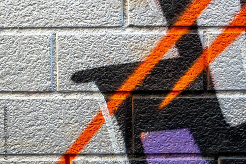 vivid street graffiti texture of colotful spray painting strips on gray metallic brick background, urban culture of modern youth backdrop