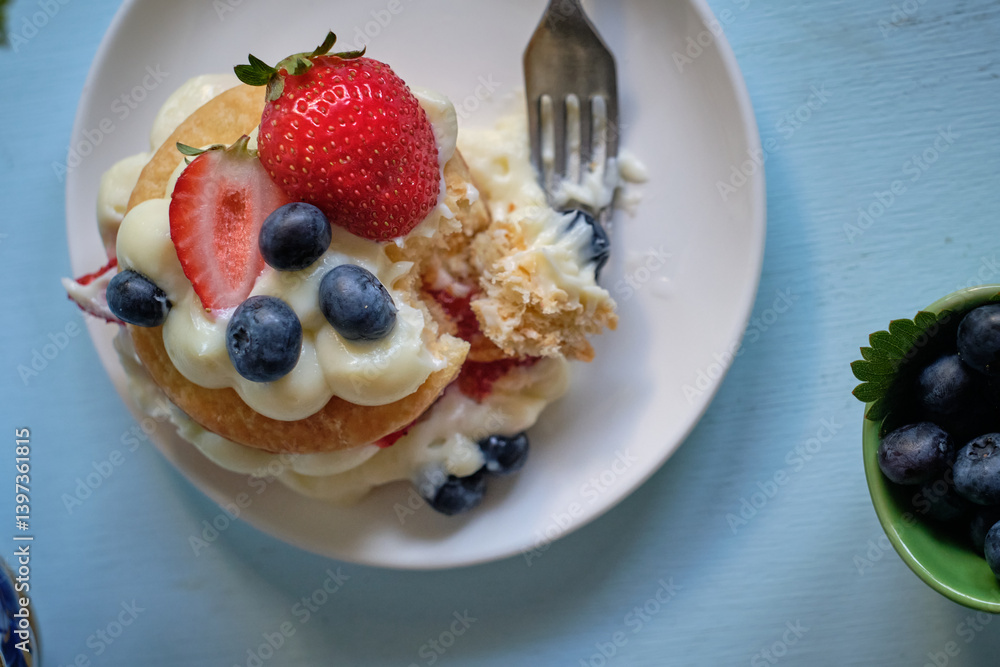 Mille-feuille cake of homemade puff pastry with strawberries and blueberries Mille-feuille cake of homemade puff pastry with strawberries and blueberries