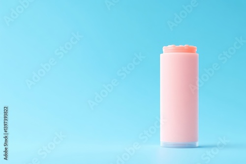 Wallpaper Mural Pink lip balm, cylindrical container, on light blue background Torontodigital.ca