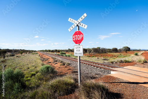 Railway crossing sign along the Adelaide–Darwin rail corridor in a remote part of the Australian Outback. The railway is used by The Ghan rail service