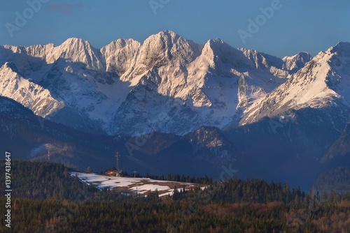 Obraz na płótnie The snow-capped peaks of the High Tatras mountains in sunrise light from viewpoint Pass over Lapszanka (Pass over Łapszanka), Podhale, Poland w salonie