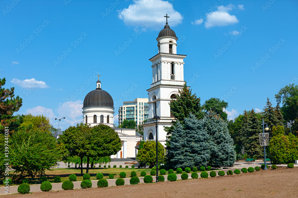 Cathedral of Christ Nativity in Chisinau from Republic of Moldova. White church with a tall bell tower and black domes stands majestically amidst lush park in the city
