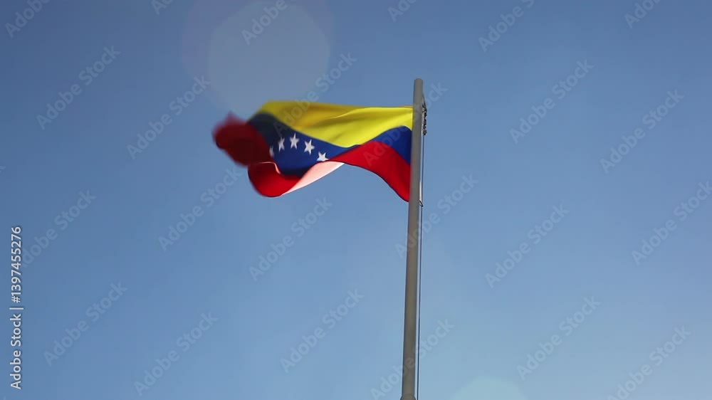 Textile flag of Venezuela on a flagpole Textile flag of Venezuela on a flagpole