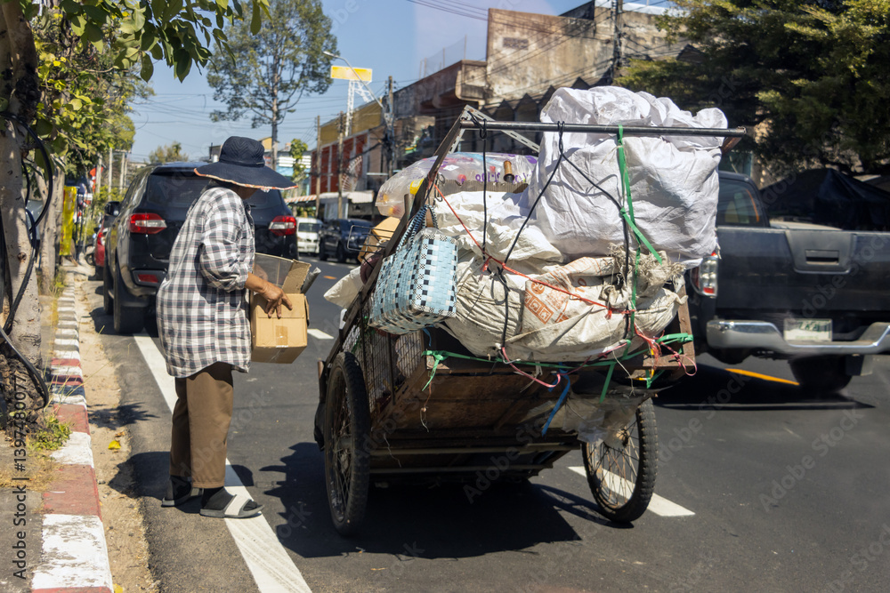 A trolley with a load of recyclable material on a street
