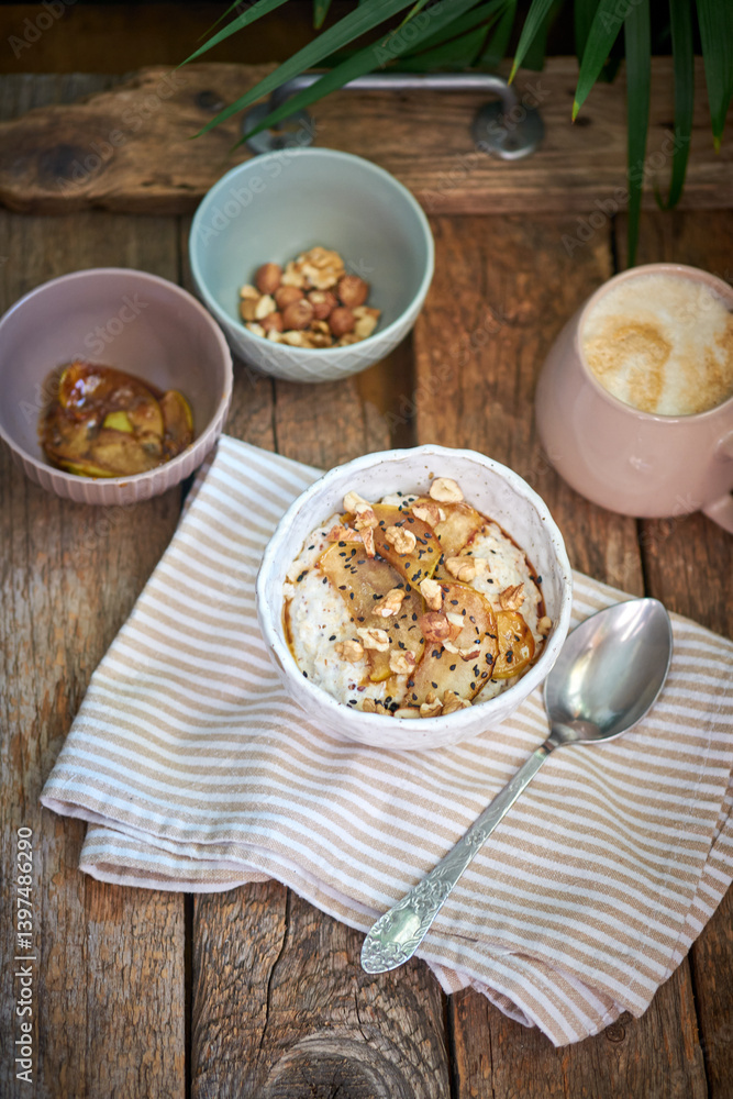 Rice pudding with caramelized apples. wooden background, side view Rice pudding with caramelized apples. wooden background, side view