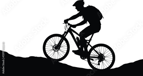 Silhouette of a cyclist riding uphill, wearing a helmet and backpack, highlighting movement and adventure