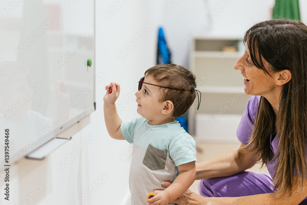 Baby boy wearing eye patch playing during eye exam with doctor Baby boy wearing eye patch playing during eye exam with doctor