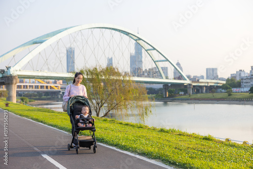 Obraz na płótnie Mother Walking With Baby Stroller By River w salonie