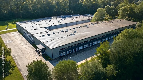 Wallpaper Mural Aerial view of a large industrial building surrounded by trees in a serene landscape Torontodigital.ca
