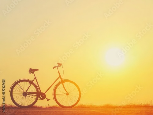 Obraz na płótnie Bicycle against yellow sun with warm lighting and space for branding w salonie