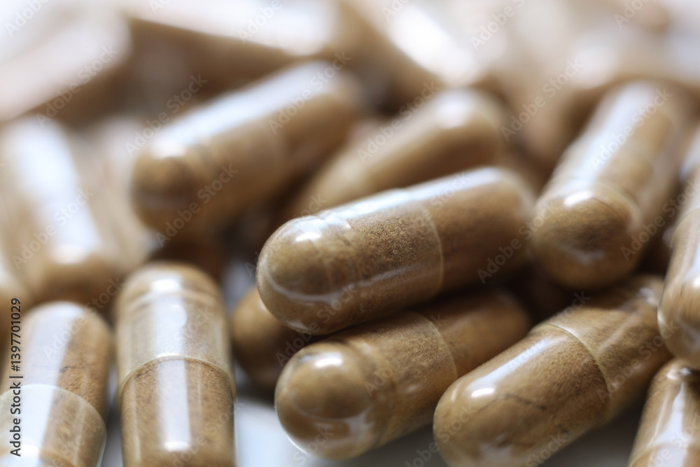 Close-up of a pile of brown pills , shallow depth of field Close-up of a pile of brown pills , shallow depth of field