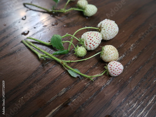 white strawberries on the wooden table design for tasty concept