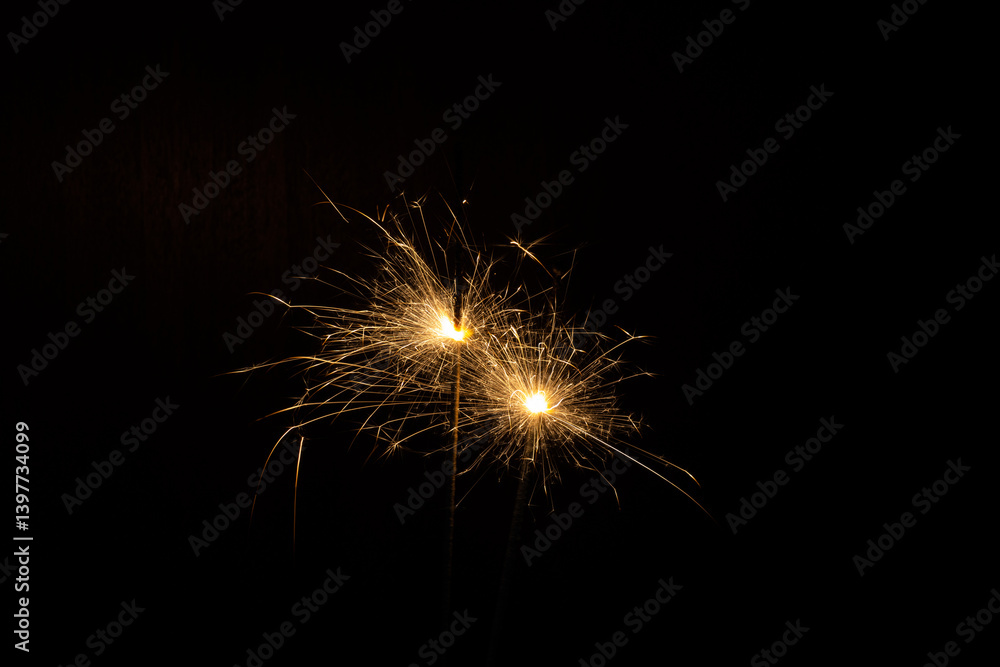 golden sparklers of bengal sparklers on a black background golden sparklers of bengal sparklers on a black background