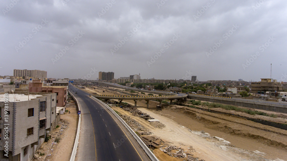 Aerial view of lyari expressway with urban skyline and busy traffic, karachi, sindh, pakistan. Aerial view of lyari expressway with urban skyline and busy traffic, karachi, sindh, pakistan.