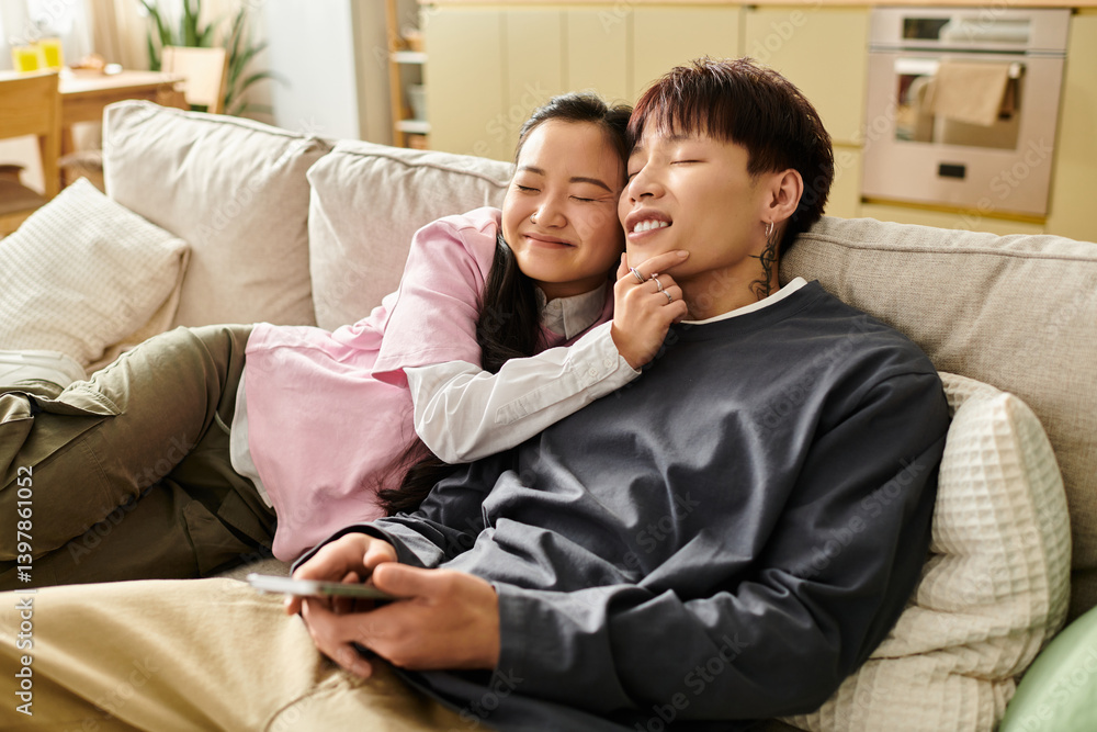 Cozy afternoon cuddles between a young couple in their modern living space Cozy afternoon cuddles between a young couple in their modern living space