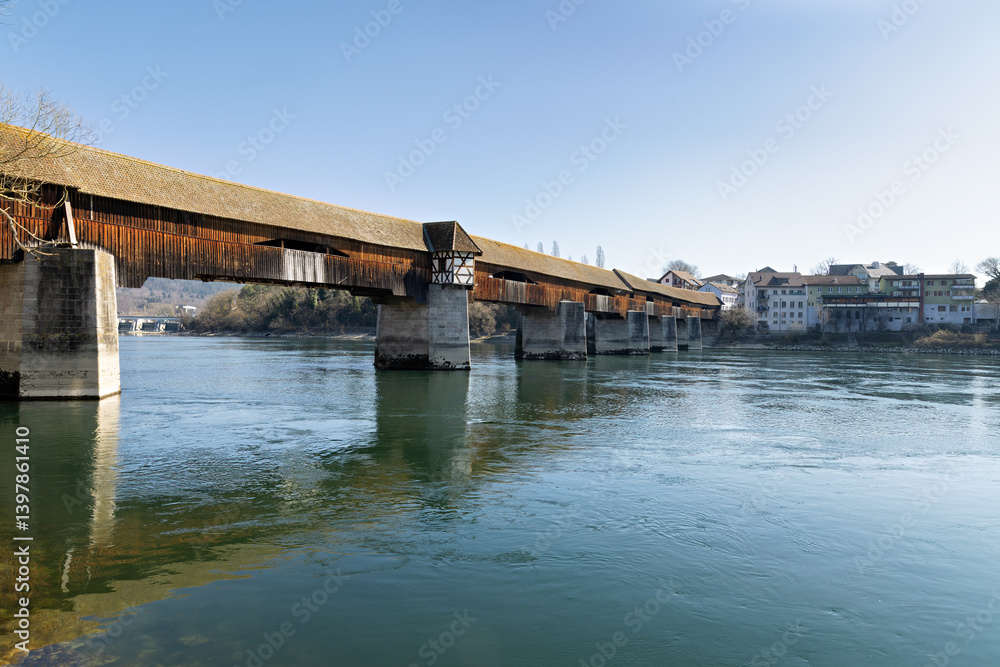 Naklejka premium Bad Saeckingen with a view of the old border bridge over the Rhine between Germany and Switzerland in spring