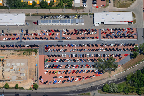 Aerial view of organized car park with vehicles and geometric patterns, Berlin, Germany.