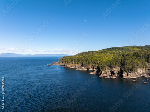 Aerial view of cape flattery with rugged cliffs, tranquil forest, and serene pacific ocean, neah bay, washington, united states.