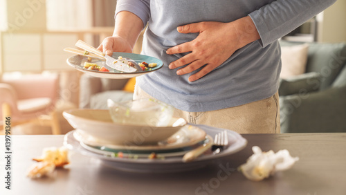 Photos Woman with bloating and stomach ache from overeating