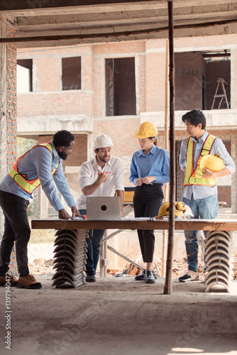 Wallpaper Mural Group of architects and engineers work together to assess the residential home construction site's progress Torontodigital.ca