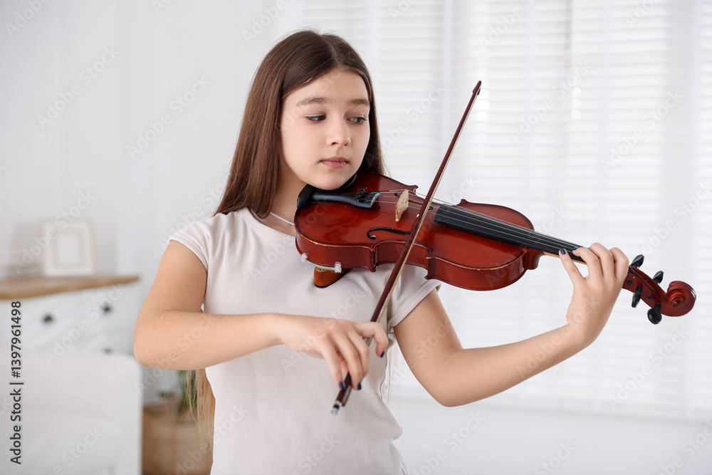 Teenage girl playing violin at music lesson Teenage girl playing violin at music lesson