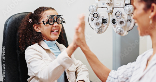 Obraz na płótnie Eye care, high five or happy optician with child in clinic with diagnostic tool for prescription lens. Ophthalmology, glasses or optometrist in vision assessment with kid, eyesight success or support w salonie