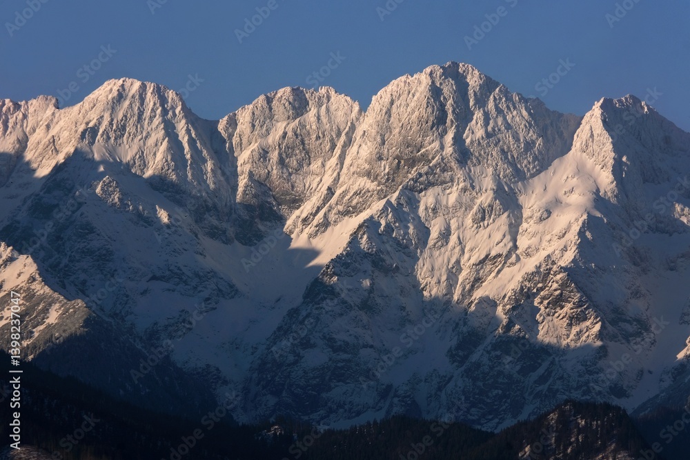 The snow-capped peaks of the High Tatras mountains (Mengusovske Stity) from viewpoint Pass over Lapszanka (Pass over Łapszanka), Podhale, Poland