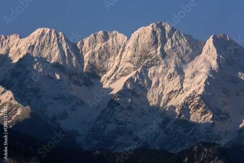 Obraz na płótnie The snow-capped peaks of the High Tatras mountains (Mengusovske Stity) from viewpoint Pass over Lapszanka (Pass over Łapszanka), Podhale, Poland w salonie