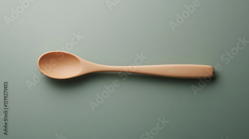 Wooden spoon on neutral background, top view