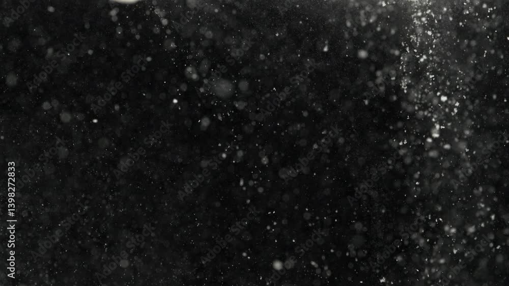 Slow-Motion Macro of Dust Particles Falling into Water Slow-Motion Macro of Dust Particles Falling into Water