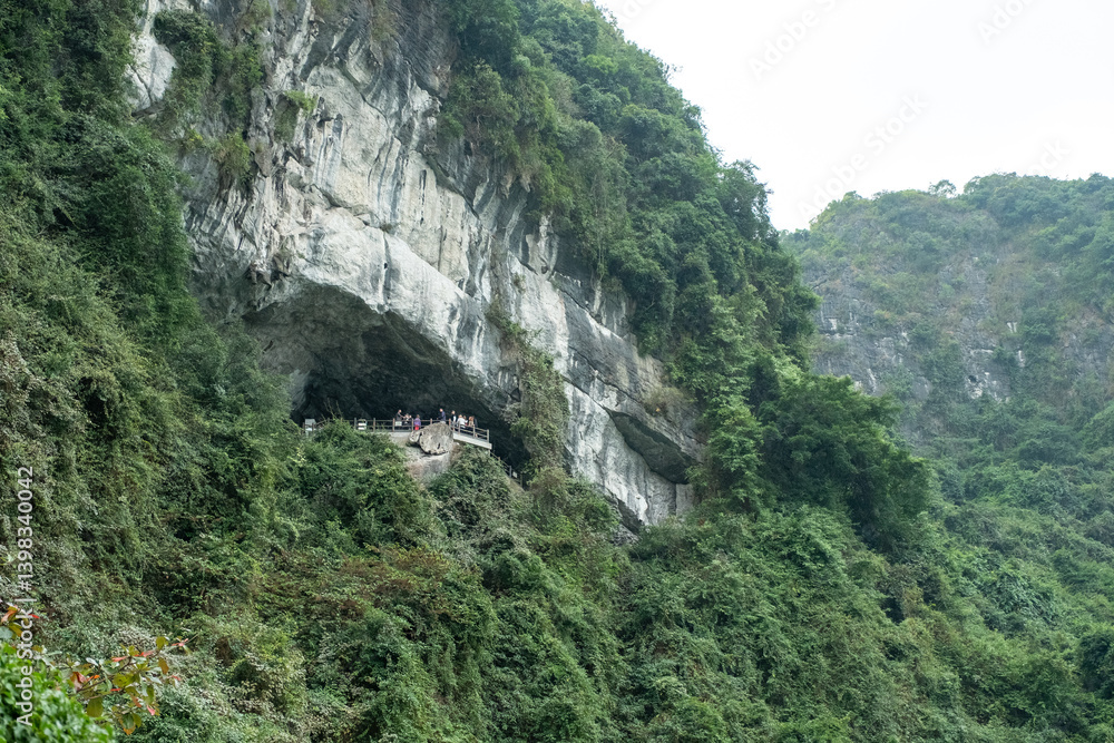 A view from within a cave looking out to the green waters and towering cliffs of Ha Long Bay, Vietnam on December 28, 2019 A view from within a cave looking out to the green waters and towering cliffs of Ha Long Bay, Vietnam on December 28, 2019