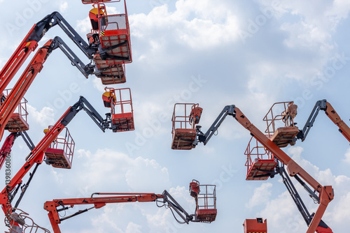 Fotografi Articulate boom lift with blue sky background, Aerial platform lift telescopic b