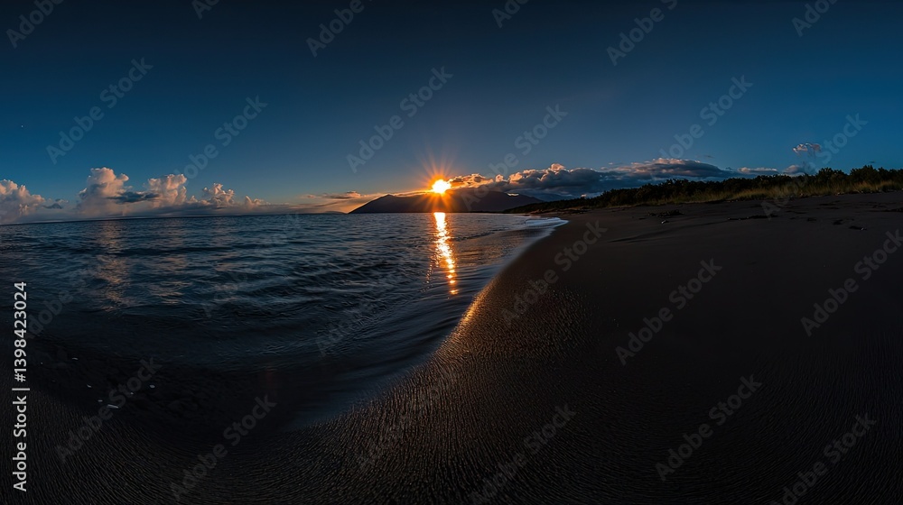 Obraz premium Beautiful sun setting over ocean water and dark sand