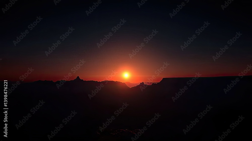 Fototapeta premium Sunset over mountains silhouetted against a dark evening sky