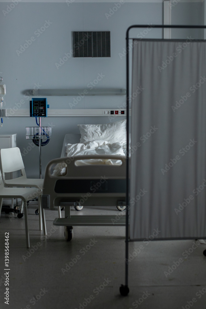 Fototapeta premium A serene hospital room with a patient bed and privacy screen for comfort and support