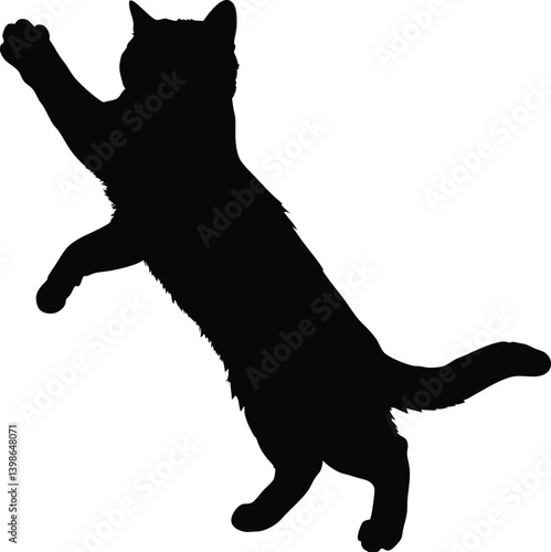 Black silhouette of playful cat standing on hind legs and reaching out