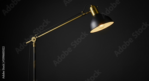 A sleek black and brass arc floor lamp illuminating a dark room with its warm, inviting glow.