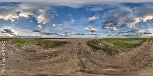 hdri 360 panorama on gravel road among farming fields with tire tracks with evening sky in equirectangular full seamless spherical projection, for VR AR virtual reality content