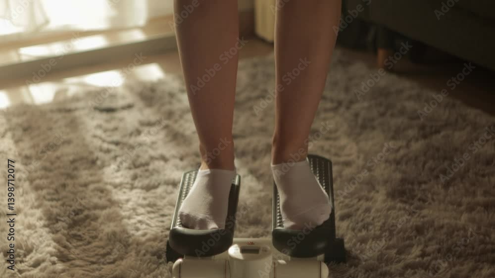 Female athlete intensely training on mini stepper, targeting leg muscles and lower body strength, working out indoors with dedicated fitness equipment Female athlete intensely training on mini stepper, targeting leg muscles and lower body strength, working out indoors with dedicated fitness equipment