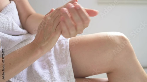 Harvest woman's hands applying cream