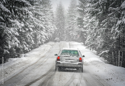Obraz na płótnie Beautiful winter scene with icy slick road driving car . Alpine road covered with water and ice and snowy trees all around w salonie