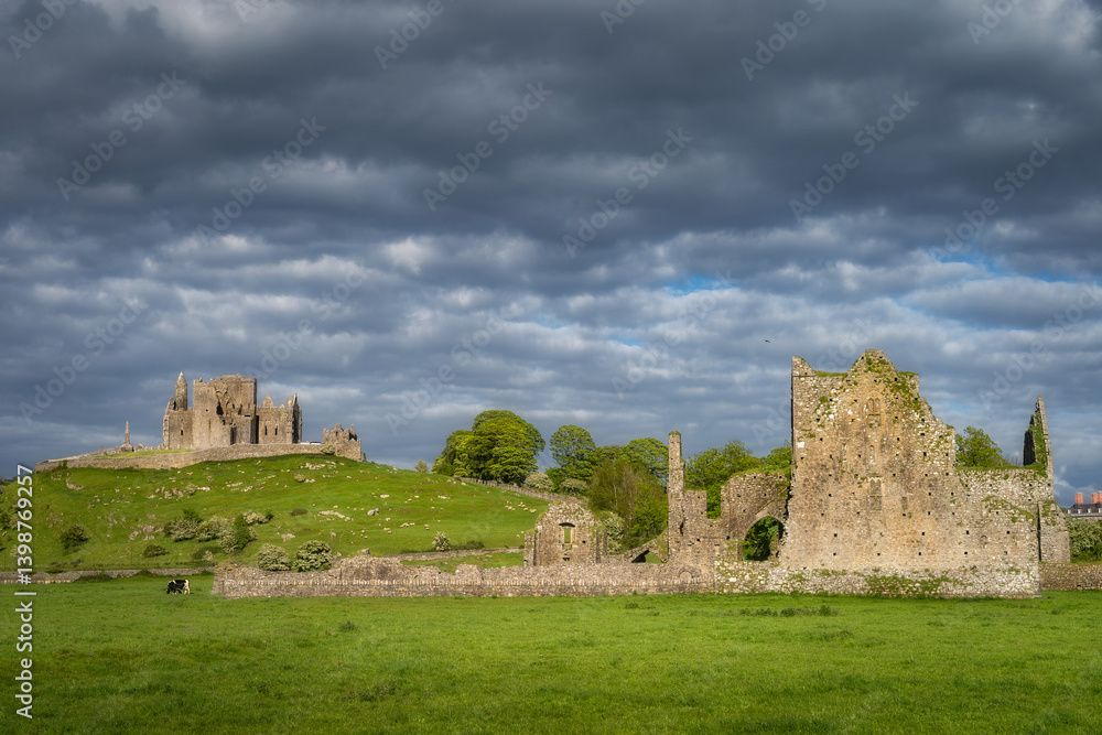 Captivating ancient ruins of Rock of Cashel and Hore Abbey nestled in a lush, green landscape that invites exploration and evokes a profound sense of history and lingering mystery, Tipperary, Ireland