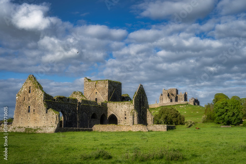 Captivating ruins of an ancient castle Rock of Cashel and Hore Abbey, set against picturesque rolling hills and vibrant greenery, inviting adventurers to connect with history, Tipperary, Ireland