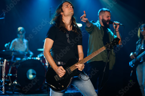 Rock band performing live on stage with passion and energy