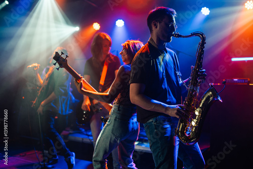 Photography Music band playing live on stage with colorful lights
