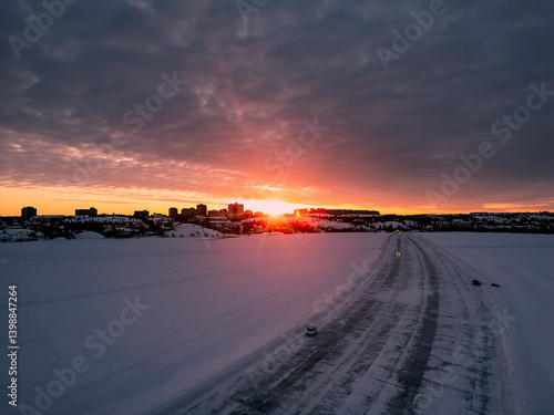 An aerial view of the Dettah Ice Road at sunset in Yellowknife, Northwest Territories, Canada