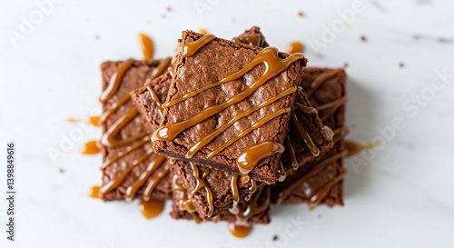 Butterscotch brownies stacked high with sticky caramel drizzle, soft and moist texture, top view on seamless white background