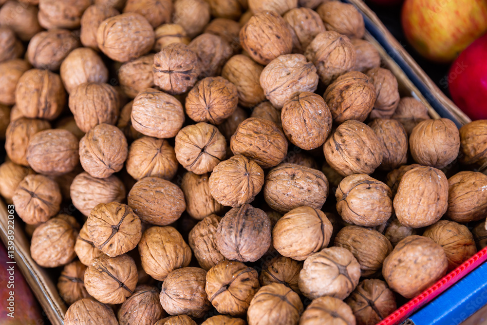 Many walnuts. Nuts in a box. Texture nuts closeup Many walnuts. Nuts in a box. Texture nuts closeup
